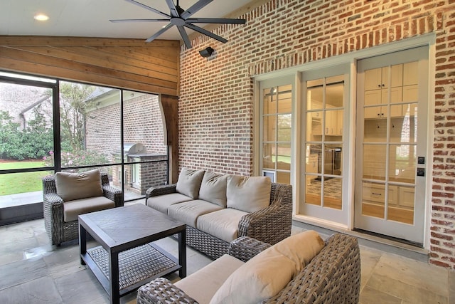 sunroom / solarium featuring vaulted ceiling and ceiling fan