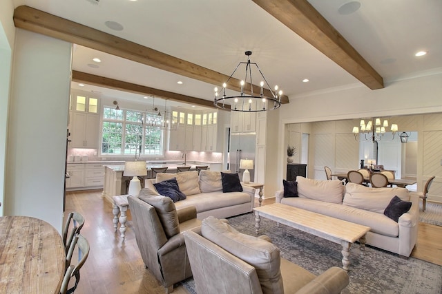 living room featuring light hardwood / wood-style floors and beamed ceiling