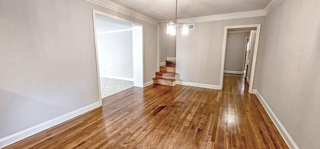 interior space with ornamental molding and dark hardwood / wood-style floors