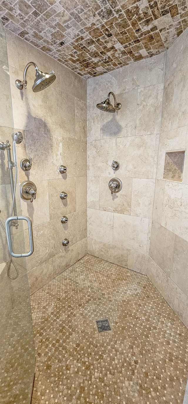 bathroom with a shower with shower door