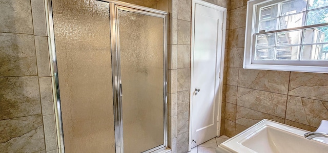 bathroom featuring walk in shower and sink