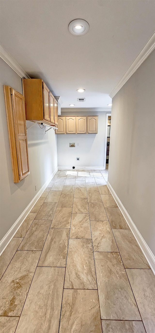 washroom featuring cabinets and crown molding