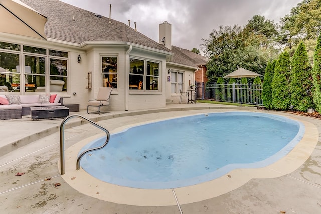 view of swimming pool featuring a patio and an outdoor hangout area