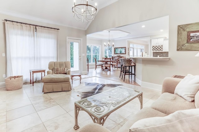 tiled living room with ornamental molding, lofted ceiling, and a chandelier