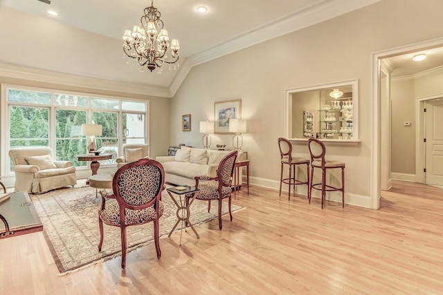 interior space with an inviting chandelier, crown molding, light hardwood / wood-style flooring, and vaulted ceiling