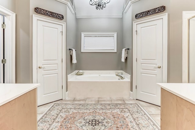 bathroom featuring ornamental molding, vanity, tile patterned floors, and a bath