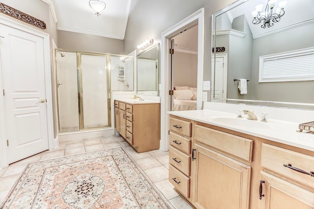 bathroom with walk in shower, vanity, lofted ceiling, and tile patterned floors