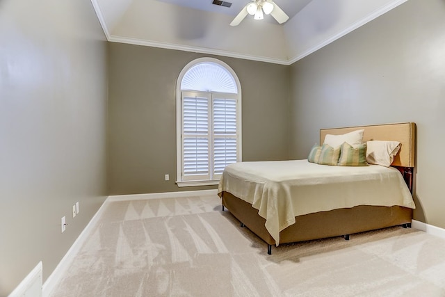 carpeted bedroom with ornamental molding, ceiling fan, and vaulted ceiling