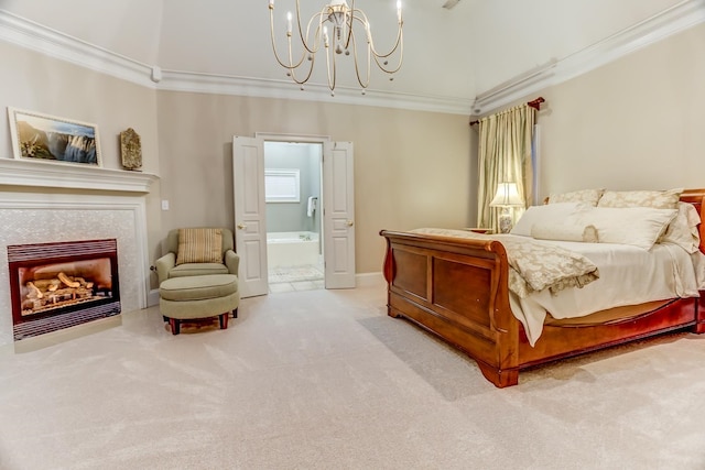 bedroom featuring a fireplace, crown molding, an inviting chandelier, light colored carpet, and ensuite bathroom