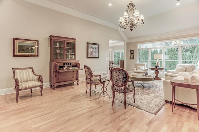 living room with ornamental molding, light hardwood / wood-style flooring, vaulted ceiling, and a notable chandelier