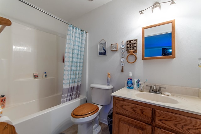 full bathroom featuring shower / bath combo with shower curtain, vanity, and toilet