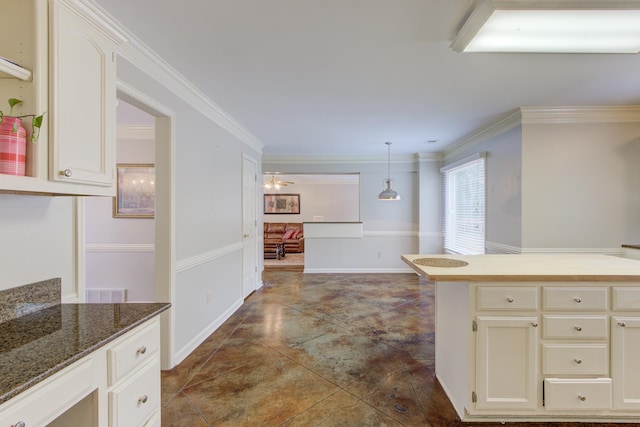 kitchen with hanging light fixtures and ornamental molding