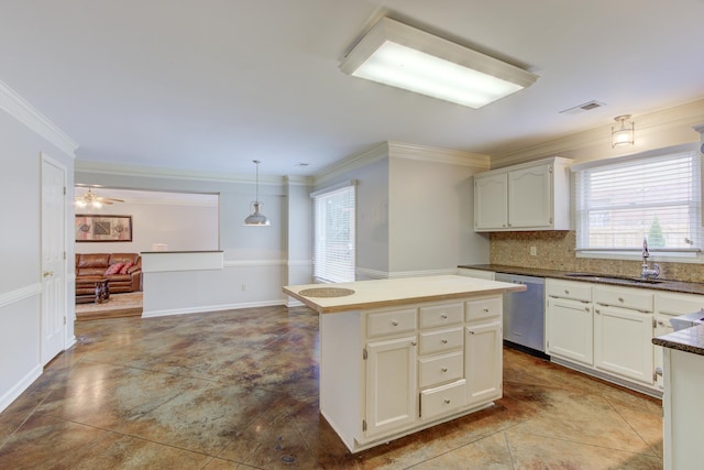 kitchen with sink, pendant lighting, a healthy amount of sunlight, and stainless steel dishwasher