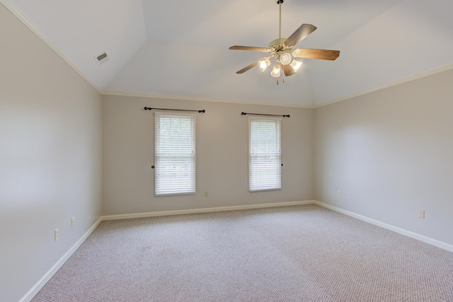 carpeted empty room with ceiling fan, lofted ceiling, and ornamental molding