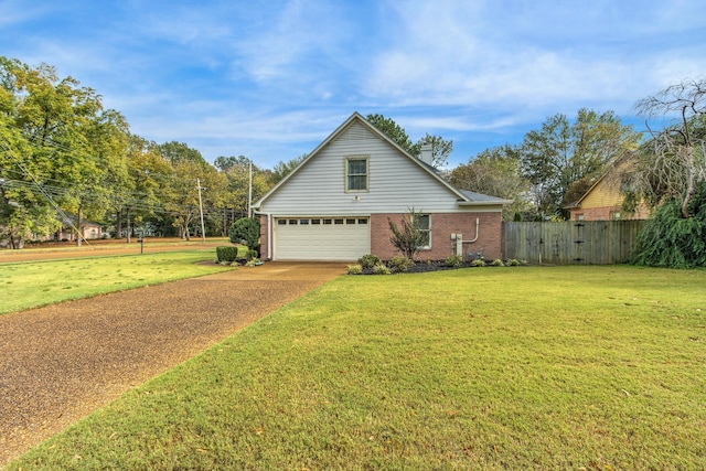 view of front facade with a garage and a front yard