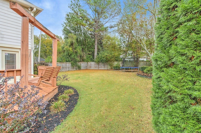 view of yard featuring a trampoline