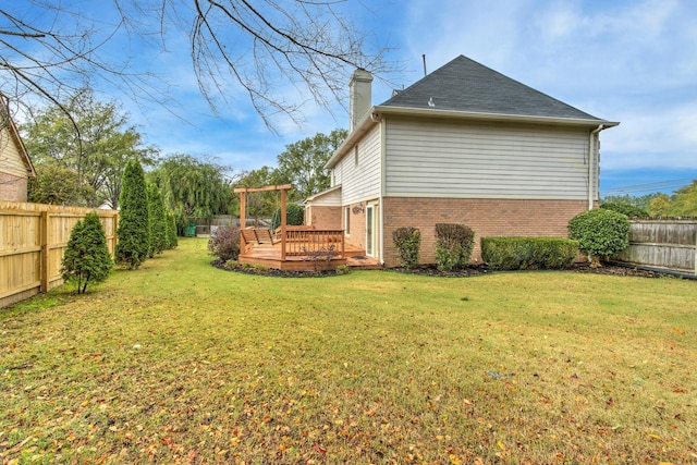 view of yard featuring a wooden deck