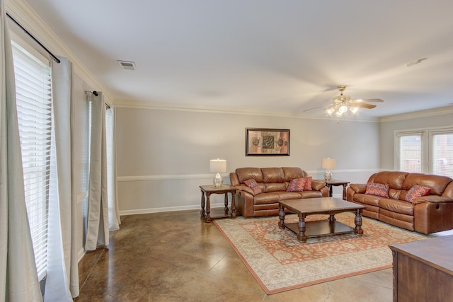 living room featuring ceiling fan and crown molding