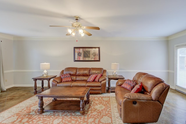 tiled living room with ceiling fan and crown molding