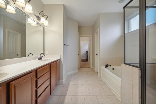 bathroom with vanity, tile patterned floors, and plus walk in shower