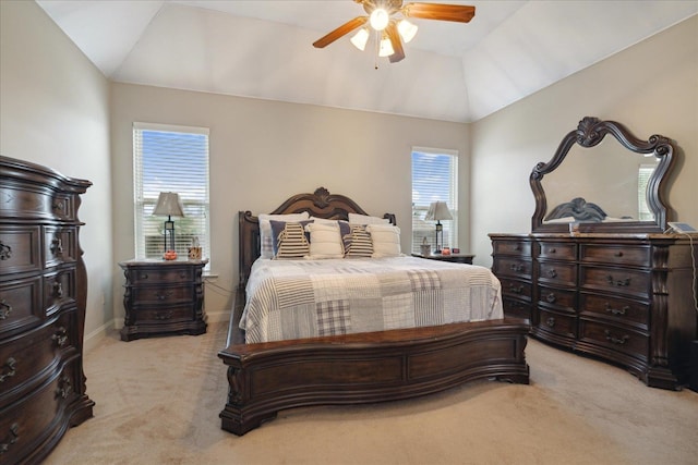 carpeted bedroom featuring ceiling fan and vaulted ceiling