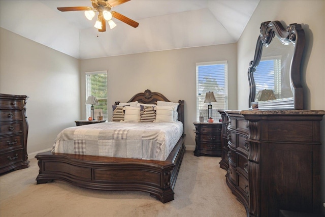 bedroom with light colored carpet, ceiling fan, and vaulted ceiling