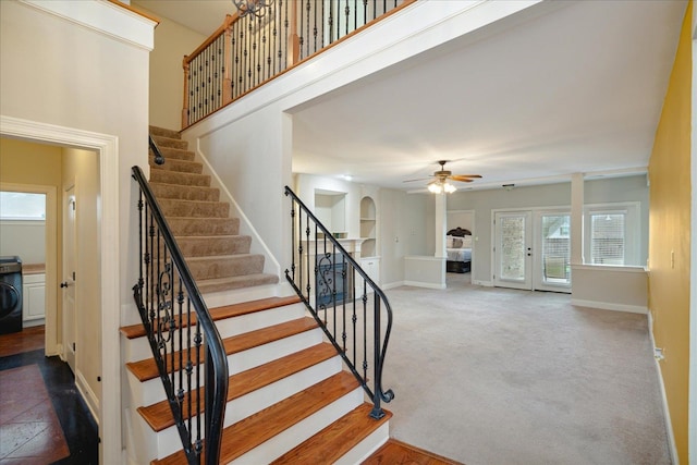 stairway with carpet, washer / clothes dryer, and ceiling fan