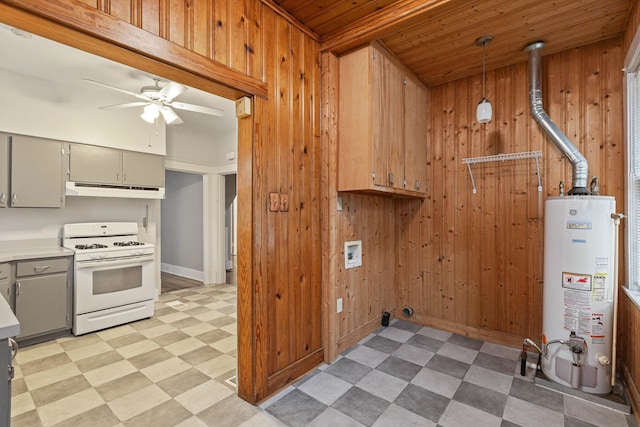 kitchen with white range with gas cooktop, wood ceiling, water heater, wood walls, and hanging light fixtures