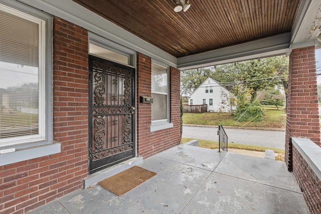 doorway to property featuring covered porch