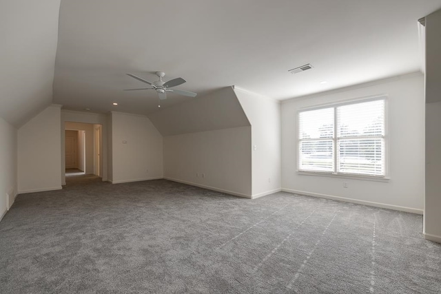 bonus room with ceiling fan, light colored carpet, and vaulted ceiling