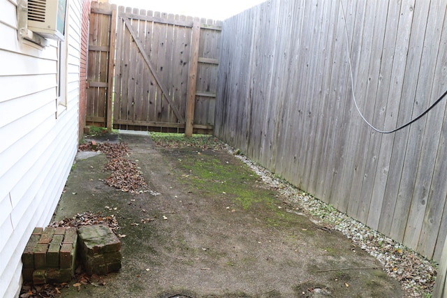 view of yard with cooling unit and fence