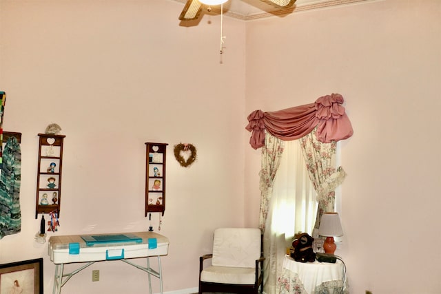 sitting room with ceiling fan