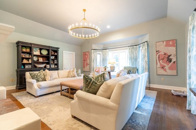 living room featuring an inviting chandelier, wood-type flooring, and vaulted ceiling