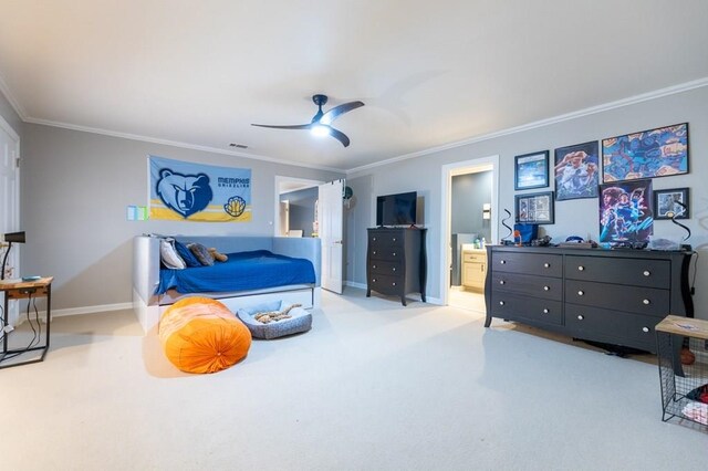 carpeted bedroom featuring ceiling fan, connected bathroom, and crown molding