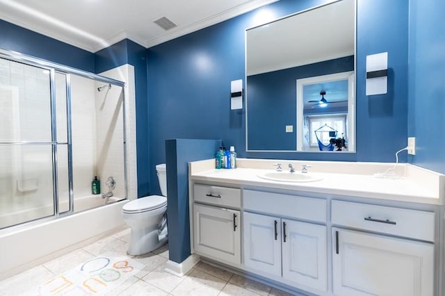 full bathroom with ceiling fan, vanity, crown molding, bath / shower combo with glass door, and tile patterned floors