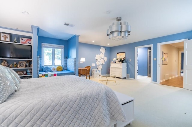 carpeted bedroom with ornamental molding