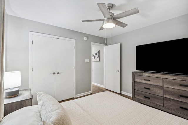 bedroom with a closet, ceiling fan, and wood-type flooring