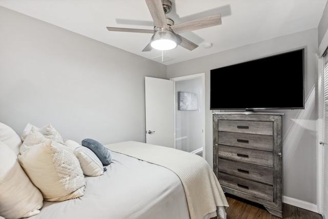 bedroom featuring ceiling fan and dark hardwood / wood-style flooring