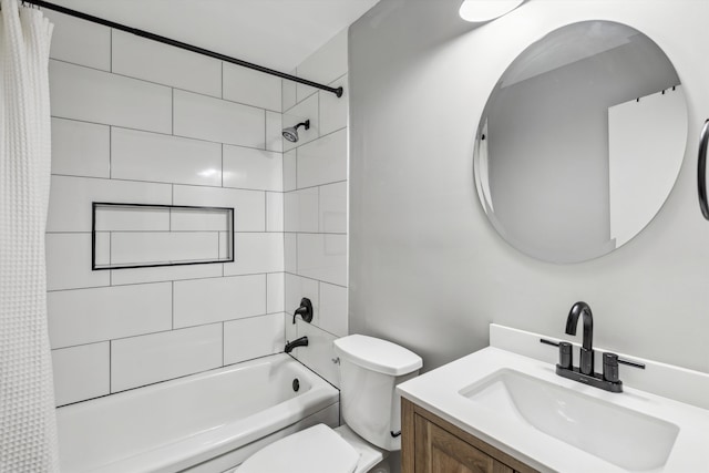 full bathroom with vanity, toilet, and shower / bath combo