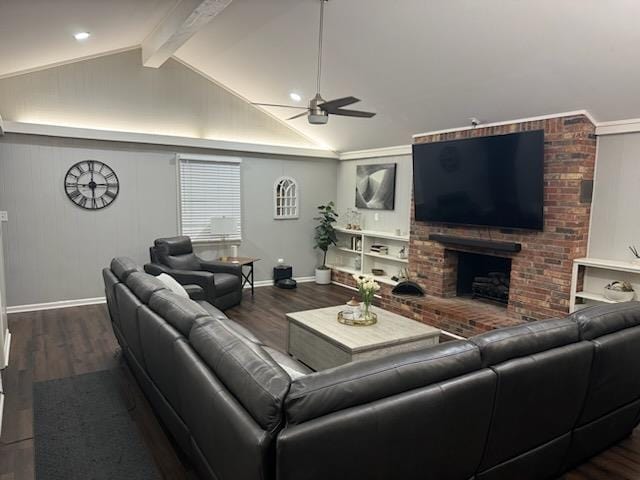 living room with wood-type flooring, lofted ceiling with beams, a brick fireplace, and ceiling fan