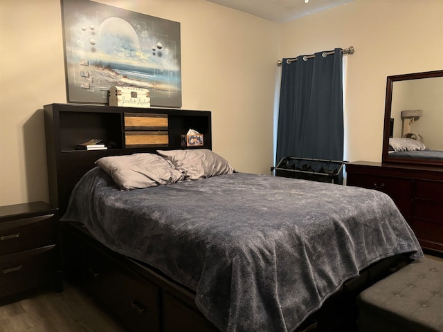 bedroom featuring wood finished floors