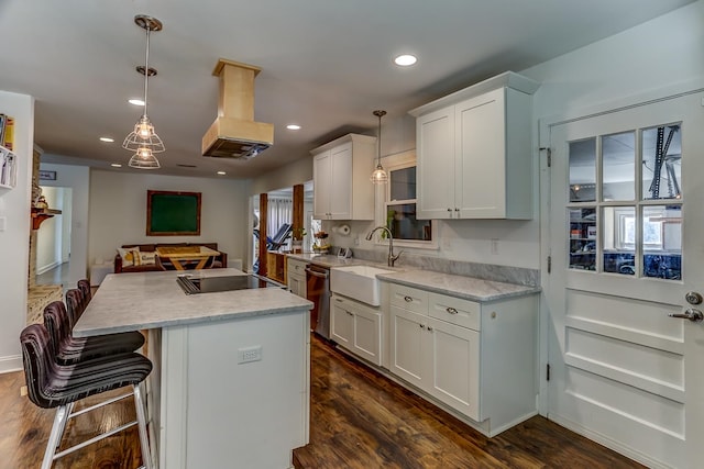 kitchen with hanging light fixtures, stainless steel dishwasher, white cabinetry, and dark hardwood / wood-style flooring