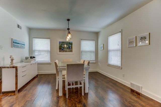 dining space featuring dark hardwood / wood-style floors