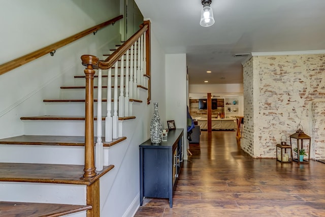 stairway featuring wood-type flooring