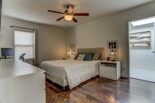 bedroom with dark wood-type flooring and ceiling fan