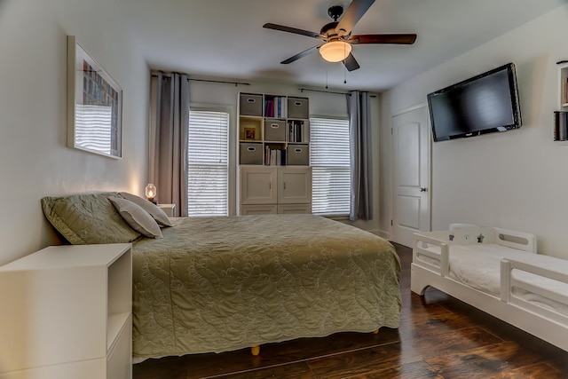 bedroom featuring dark wood-type flooring and ceiling fan