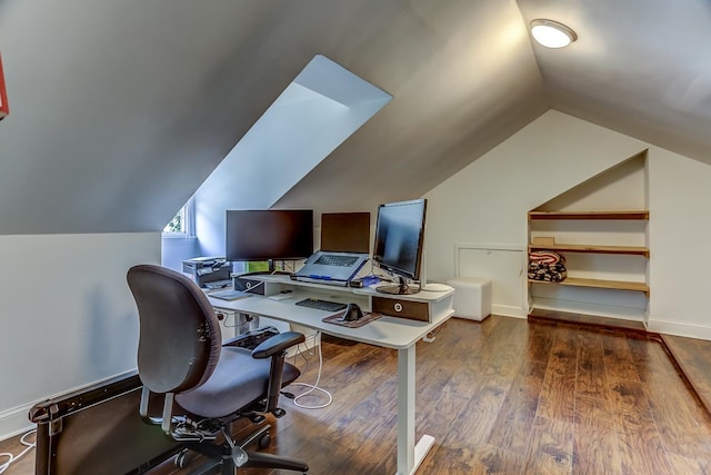 office area with dark wood-type flooring and vaulted ceiling with skylight