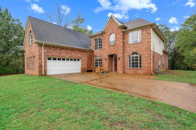 view of front of property with a garage and a front lawn