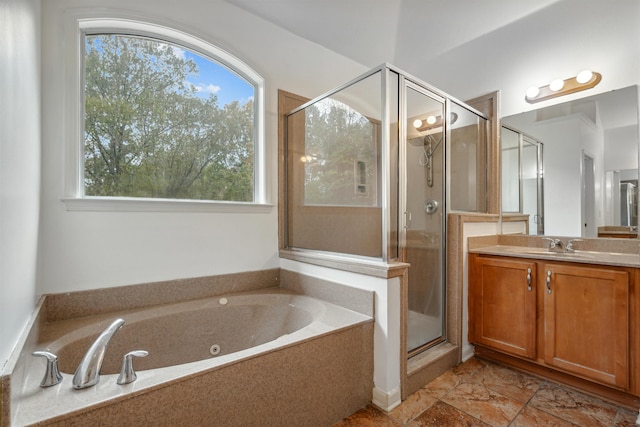 bathroom featuring vanity and separate shower and tub