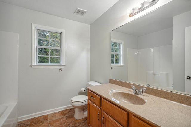 bathroom featuring vanity and toilet